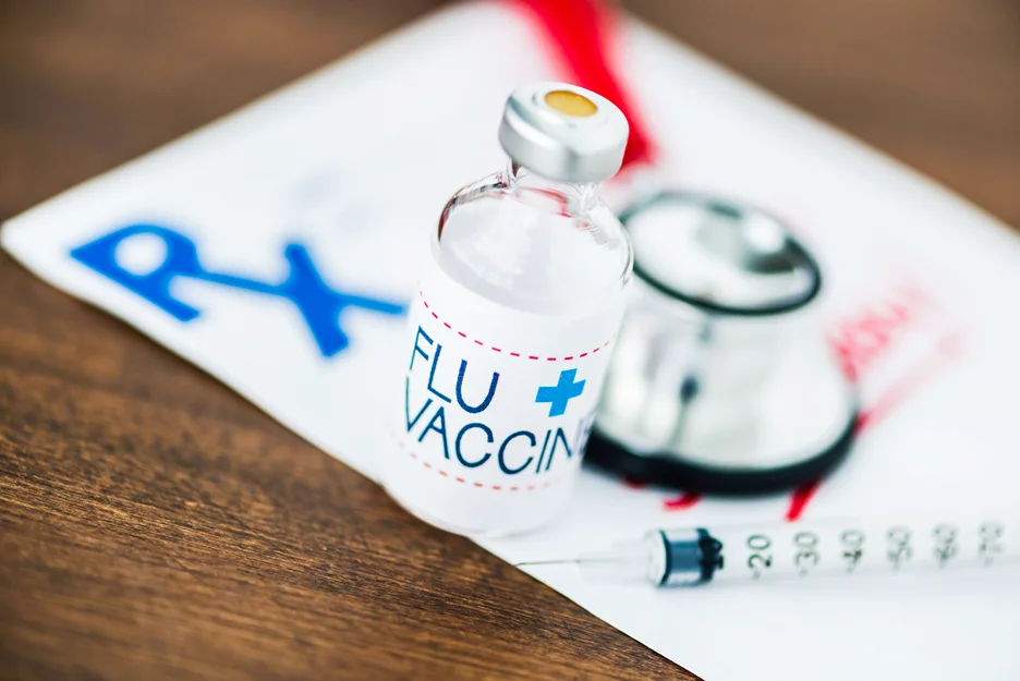 flu vaccine and a stethoscope