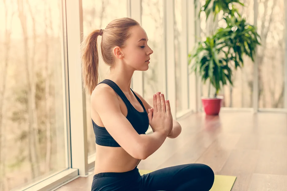 a young woman had yoga lesson inside a gym