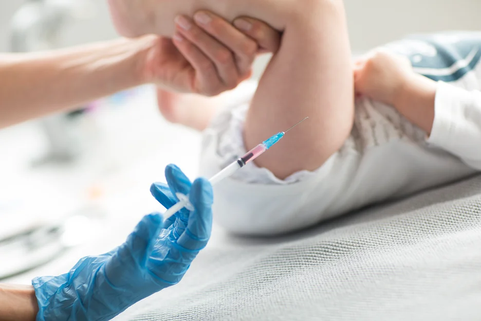 a baby is injected with Hepatitis B vaccine