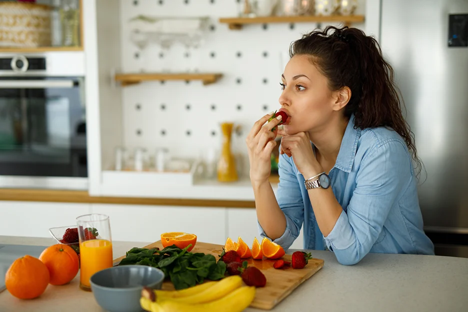 a woman eating a healthy meal