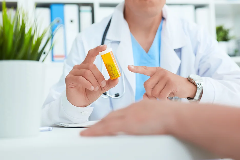doctor instructs dosage of prescription medicine to the patient