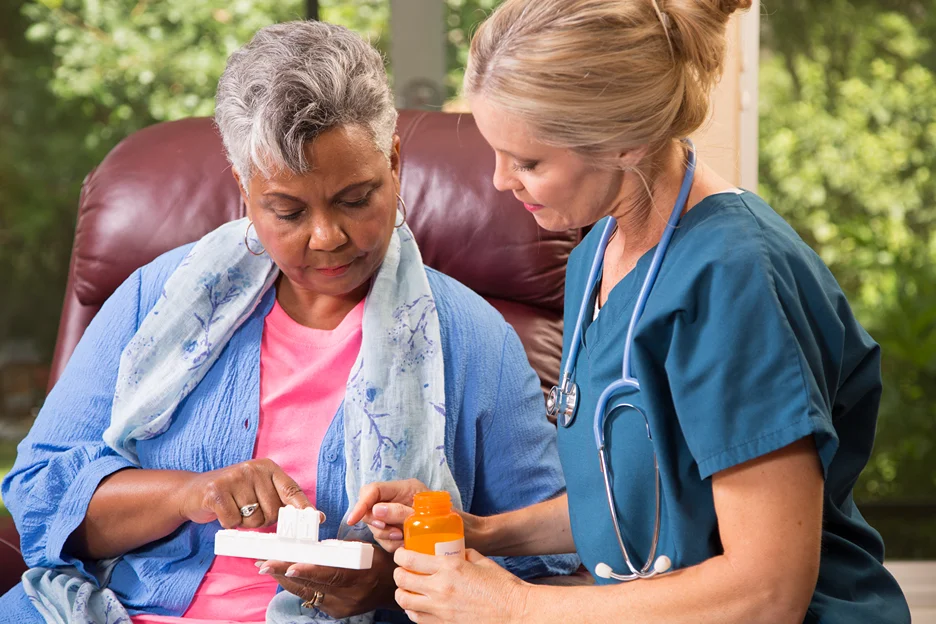 a senior woman consults her doctor for her medication dosage