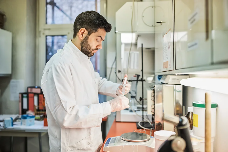 a researcher conducts trials inside a laboratory