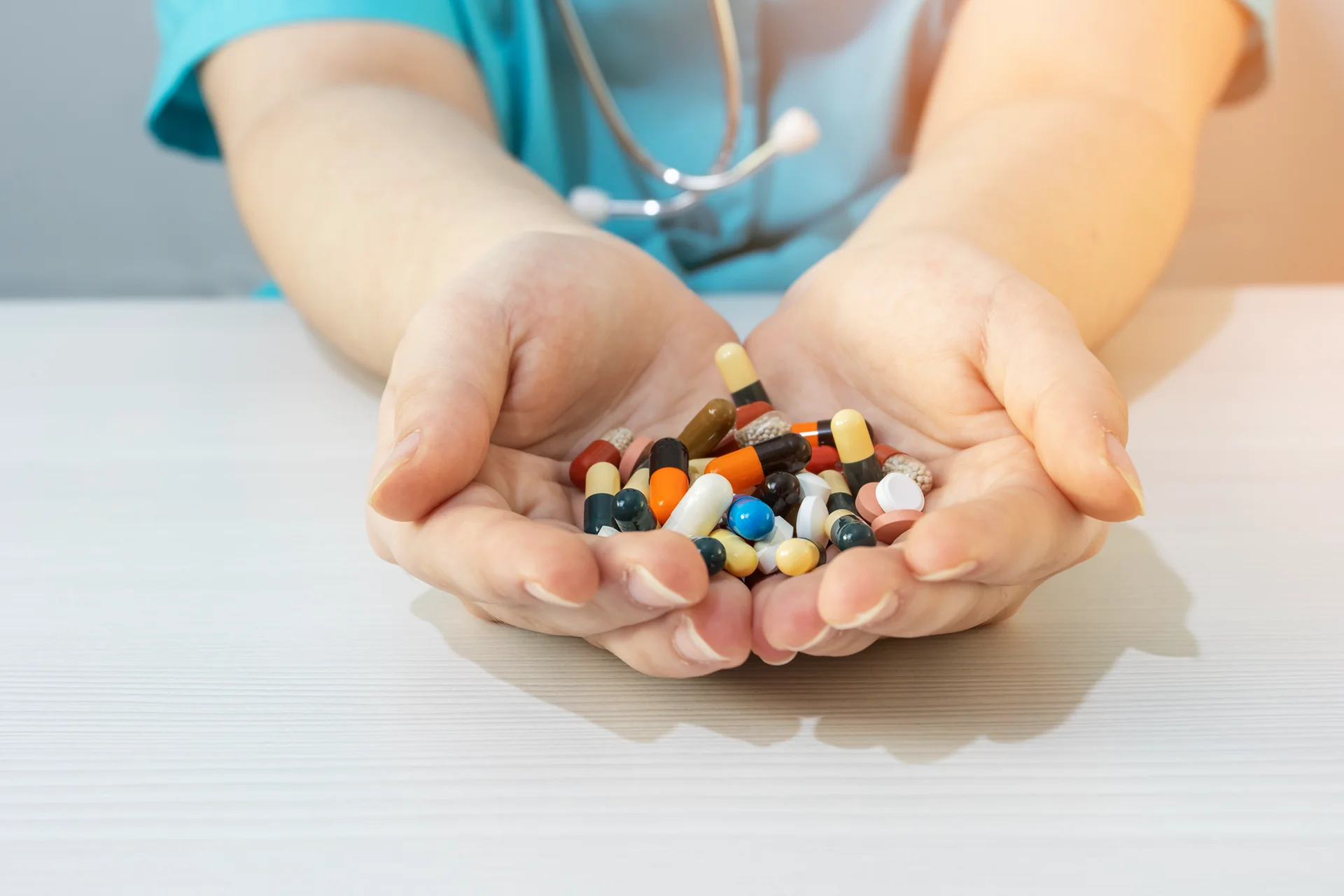 a doctor holding different kind of pills