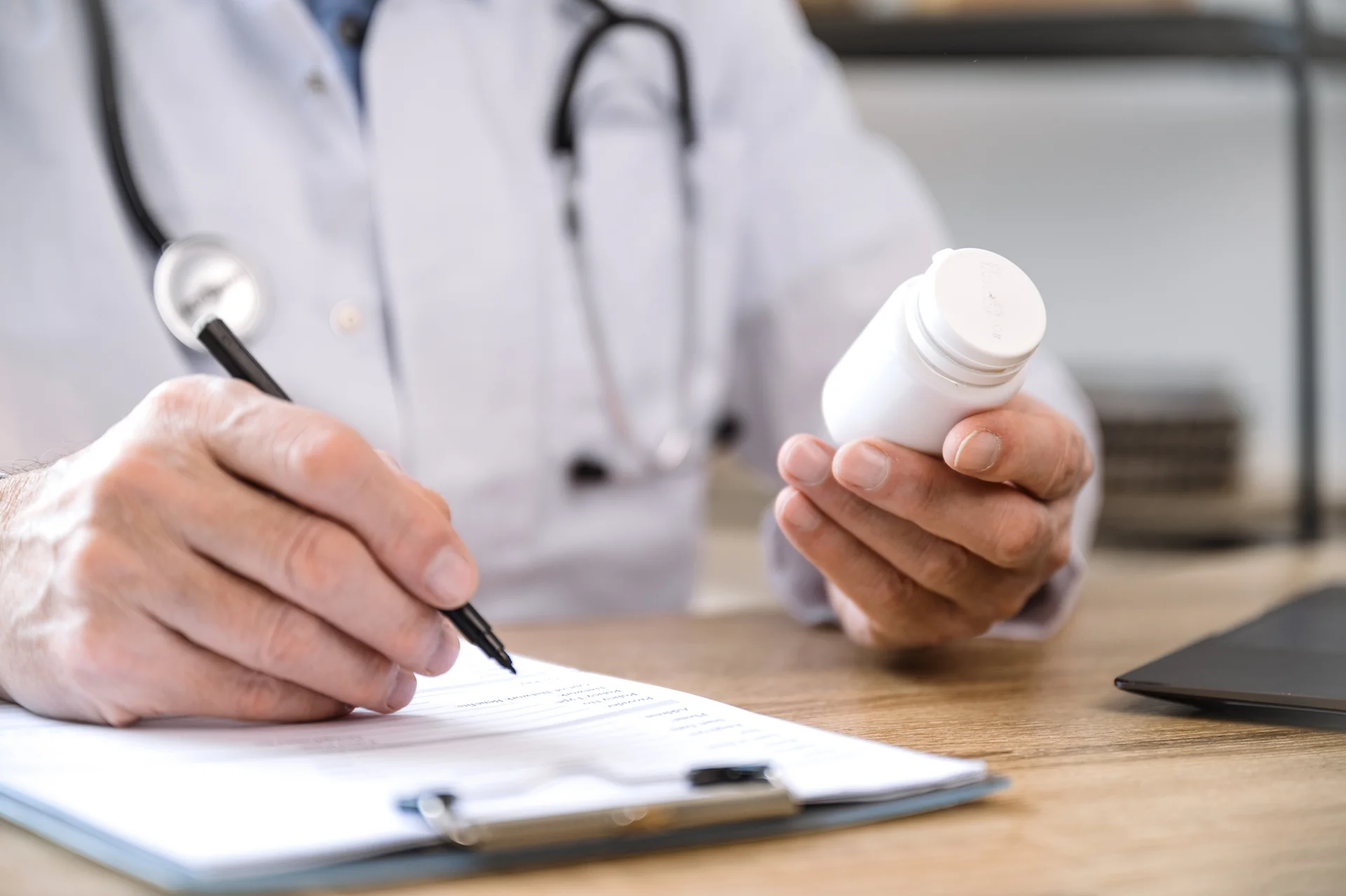 a doctor writing a prescription